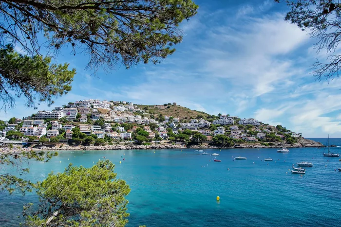 Coastal whitewashed town on hillside overlooking the sea, Andalusia, Spain
